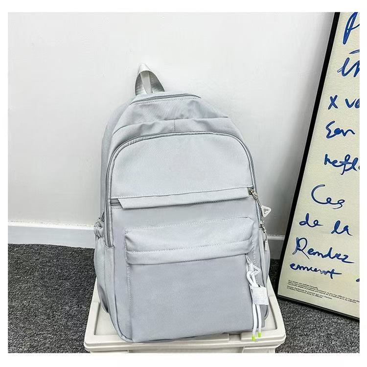 Minimally designed solid color backpack for both shoulders E1305