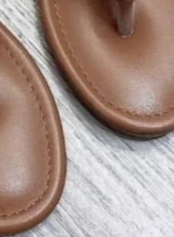 Wearing flip flops with a flat bottom on the outside E1330